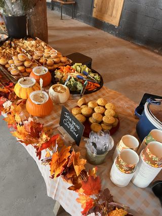 Fall harvest dessert spread with pumpkin servers and cornbread